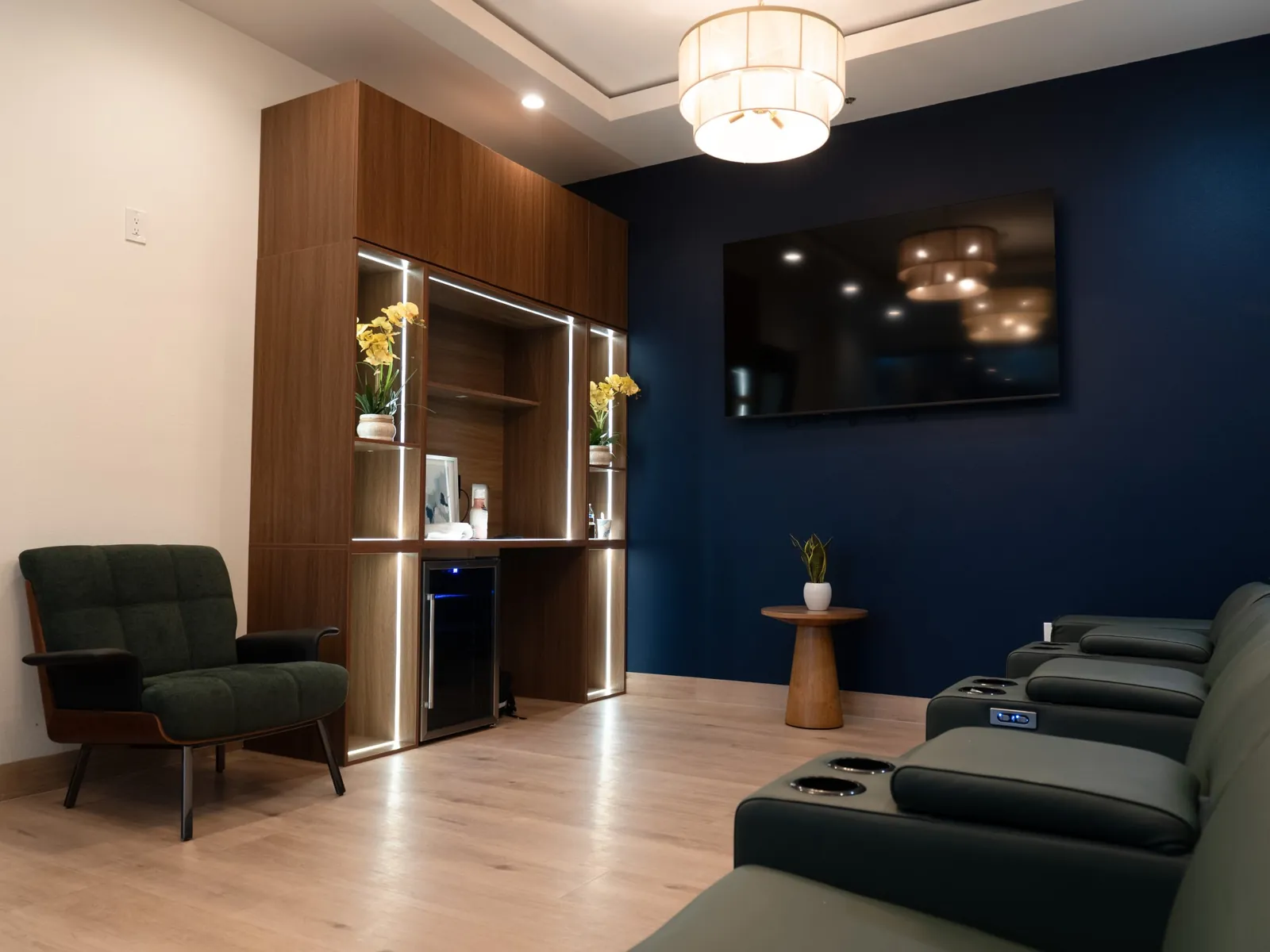 Private group IV lounge with power recliners, wall TV and refreshment bar at our Rancho Bernardo clinic